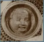 Arnolfo di Cambio ; Cosmati , Testa che ride